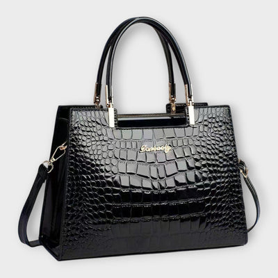 Bolso de mano con estampado de cocodrilo brillante